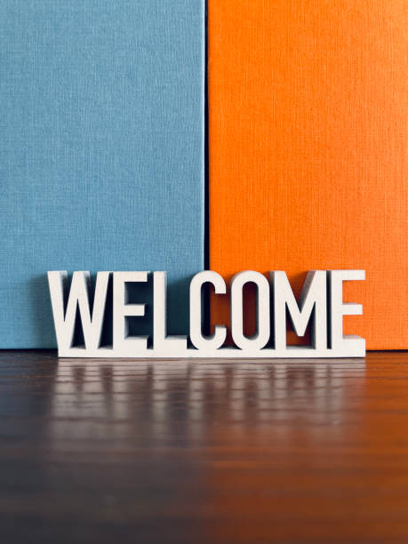 istock Welcome sign on blue orange background 1312298892