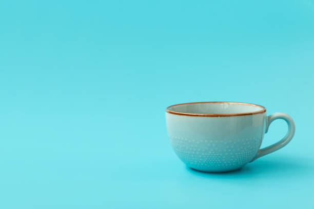 istock Blue cup of tea on blue background 1312298897