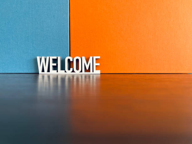 istock Welcome sign on blue orange background 1312299556