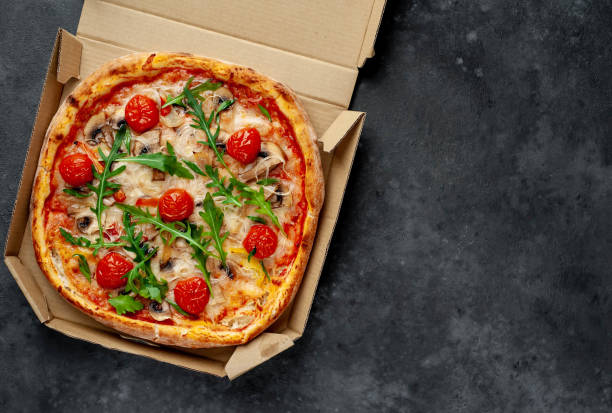 istock delicious homemade pizza on stone background with copy space for your text 1312299582