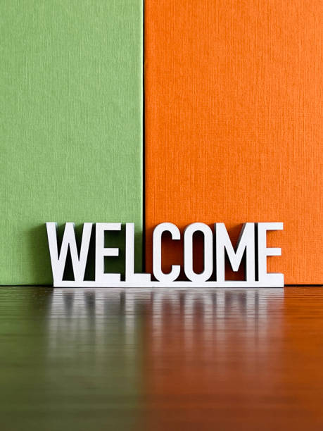 istock Welcome sign on green orange background 1312299743