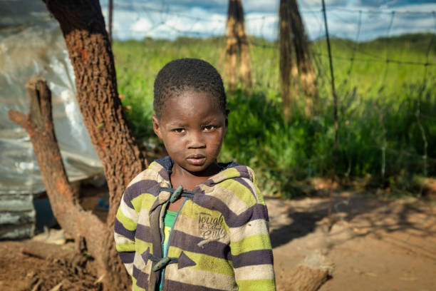 istock African child with a tough look standing in his yard 1312299769
