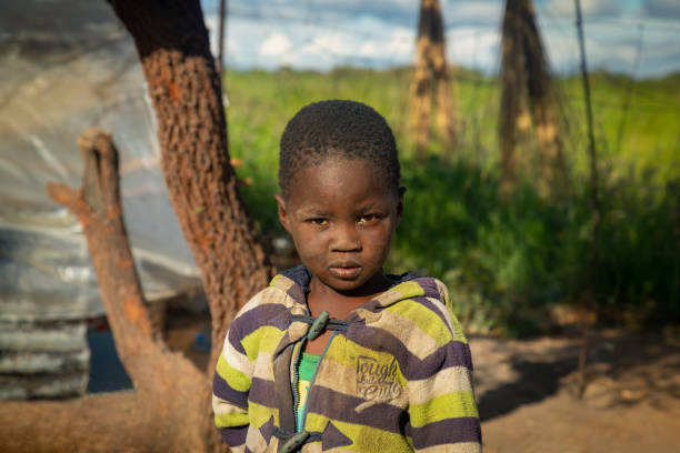 istock African child with a tough look standing in his yard 1312299791