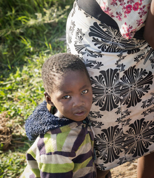istock Small kid in an African village 1312299804