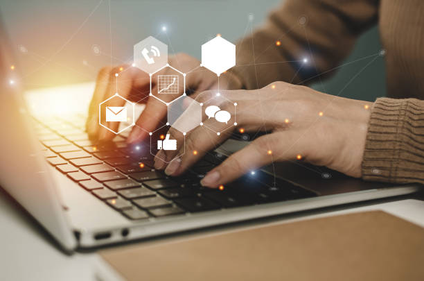 istock work from home. working woman using laptop computer on desk at home office with virtual digital icon, business, social media, mail, digital marketing, social network and connection technology concept 1312300933