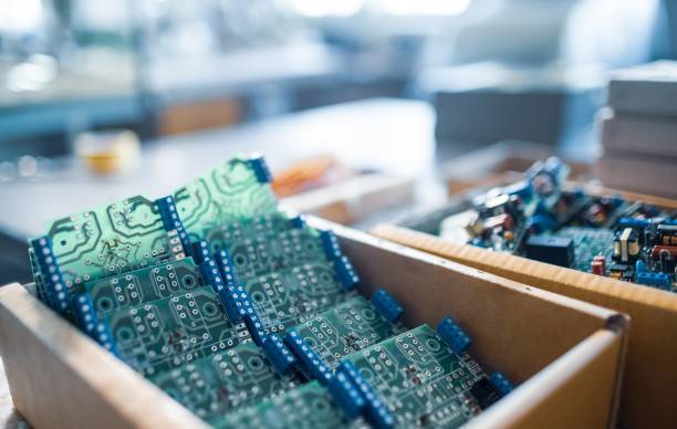 istock Close-up electric green embedded microcircuits in production 1312302173