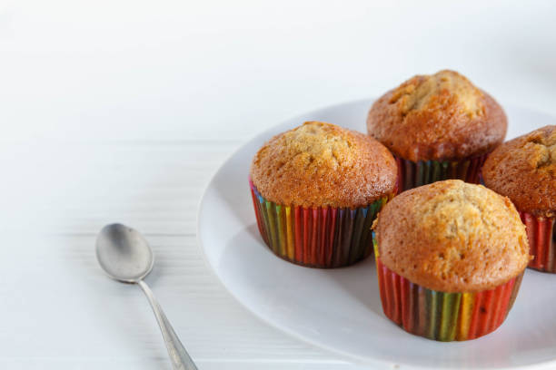istock Home made cupcakes menu on white wooden table 1312302792