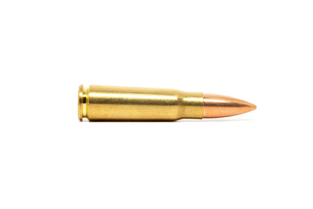 istock One bullet isolated on white background. Cartridge 7.62 caliber for Kalashnikov assault rifle closeup 1312303555