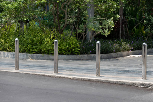 istock stainless steel bollards at concrete pavement. 1312305493
