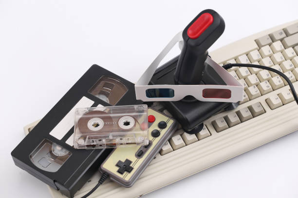 istock Retro joystick, gamepad with 3d glasses, audio and video cassette, old keyboard on a white background. Attributes 80s 1312309267
