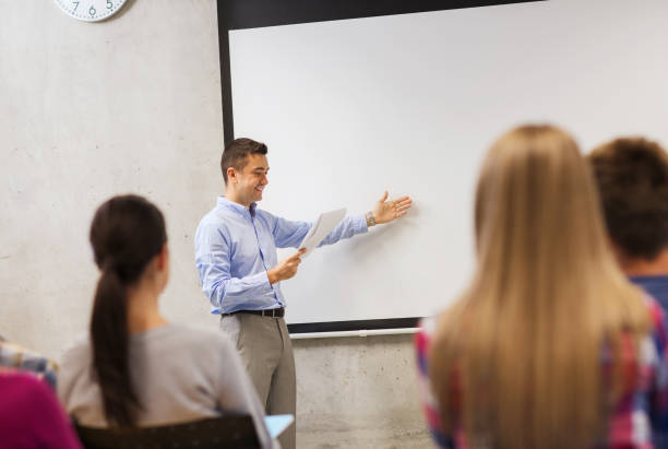 istock group of students and smiling teacher with notepad 1312309312
