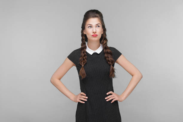 istock Thoughtful woman looking up and pondering. 1312310581