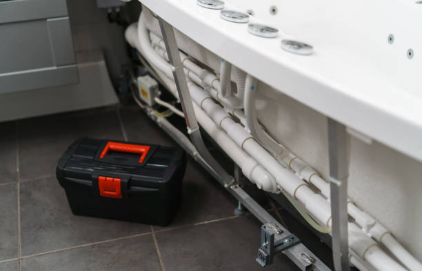 istock Toolbox near pipe system of bathtub with hydromassage. 1312311071