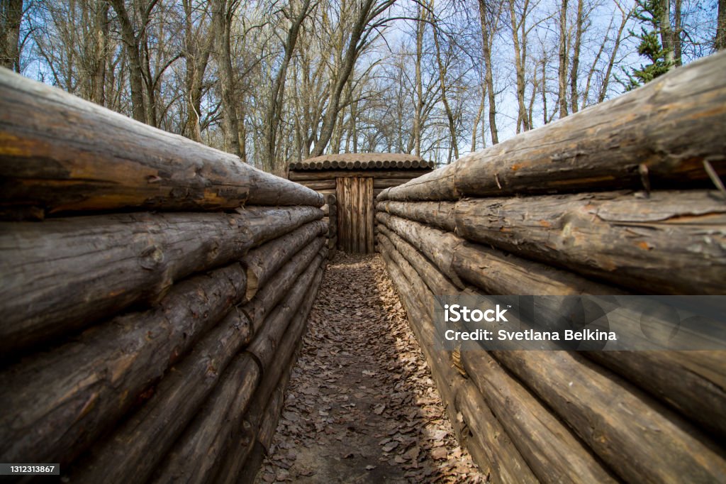 A trench fortified with logs with a dugout. Victory Day. The Second World War. Monument to the fallen soldiers. Accidents and Disasters Stock Photo