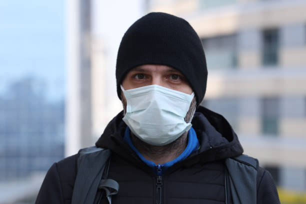 istock Man with protective face mask to prevent from COVID-19 1312313998