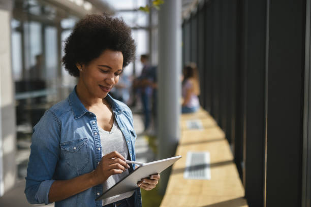 istock A successful female web designer using digital tablet in the office hallway 1312316145