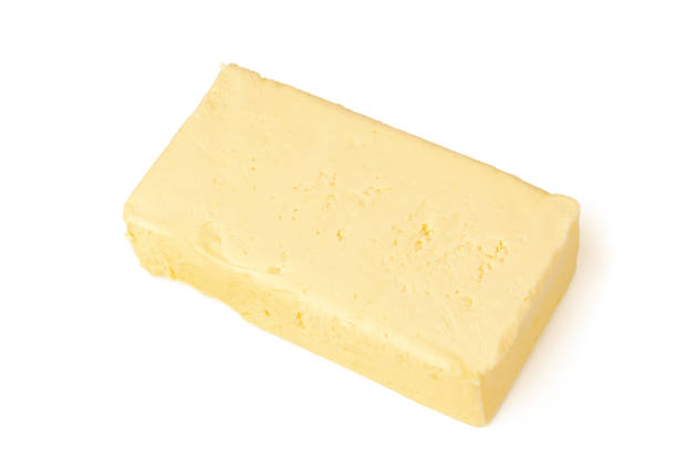 istock Block of butter isolated on white background 1312317523