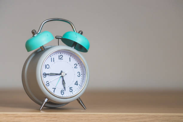 istock Retro styled white alarm clock, isolated and copy space 1312317765
