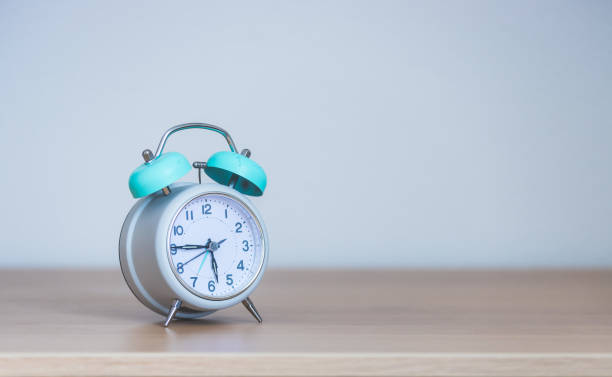 istock Retro styled white alarm clock, isolated and copy space 1312317782