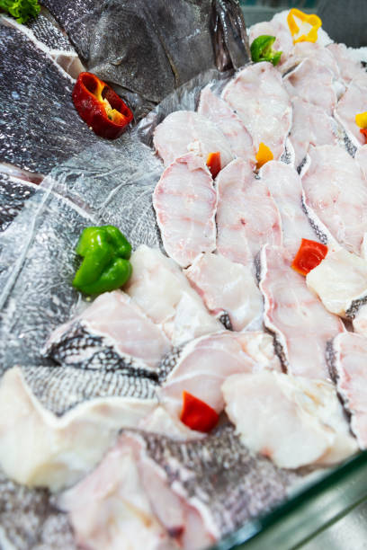 istock Fishmonger shelf in supermarket with fresh fish. 1312319060