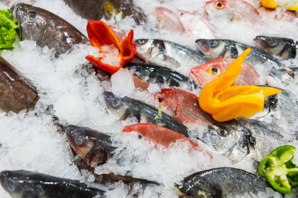 istock Fishmonger shelf in supermarket with fresh fish. 1312319313