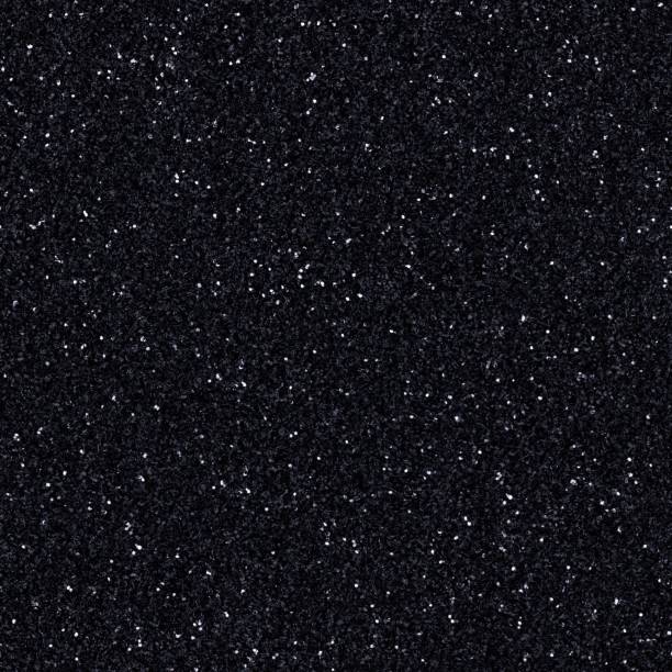 istock Elegant dark gray, black glitter, sparkle confetti texture. Christmas abstract background, seamless pattern. 1312320623