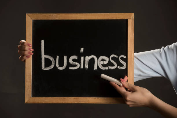 istock holding up a business sign 1312322053