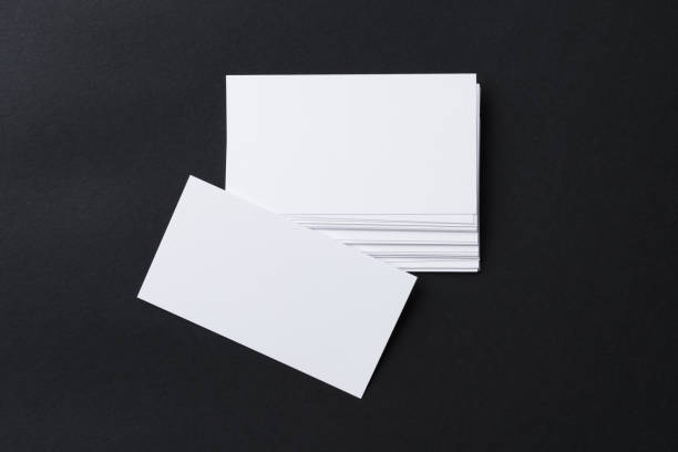 istock White blank business cards on dark black background 1312322174