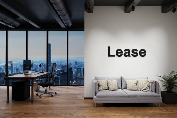 istock modern luxury loft with skyline view and vintage couch and pc workspace, wall with lease lettering, 3D Illustration 1312323213