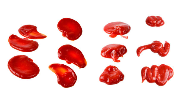 istock Red sauce splashes isolated on white background. Ketchup. 1312323564