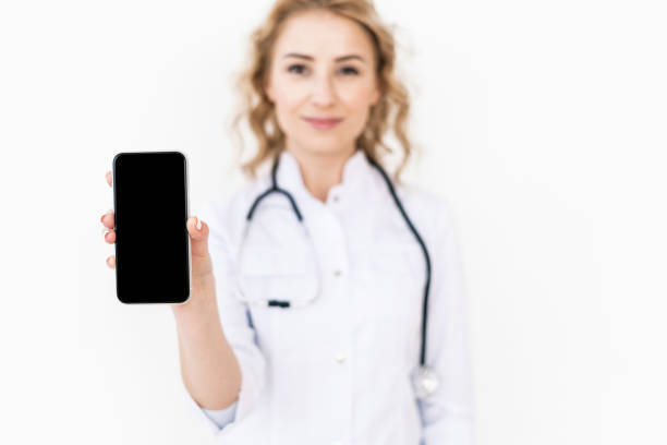 istock Doctor in white uniform against white background 1312326600