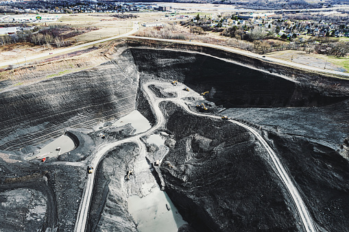 Aerial drone view of an open pit coal mine.