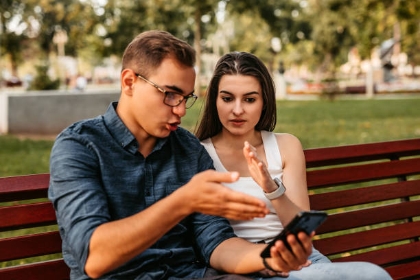 istock Couple checking social media on phone 1312326796