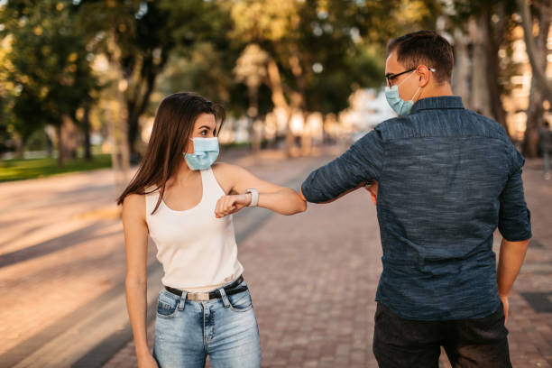 istock Couple greeting with elbow bump on date 1312326867