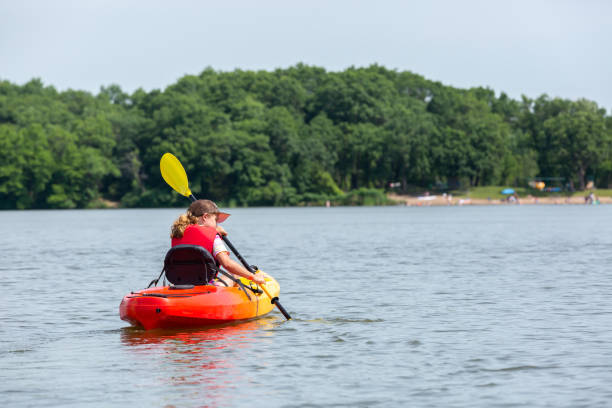 istock Girl Kayaking on Lake in Summer 1312326906