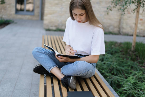 istock Adult university student girl preparing homework for classes 1312327734