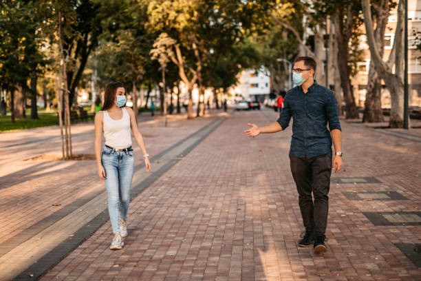 istock Young couple making social distance on date 1312328062