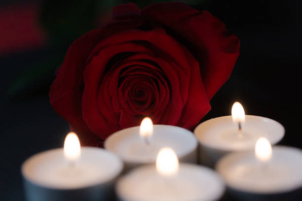 istock Rose with candles, red background 1312328948