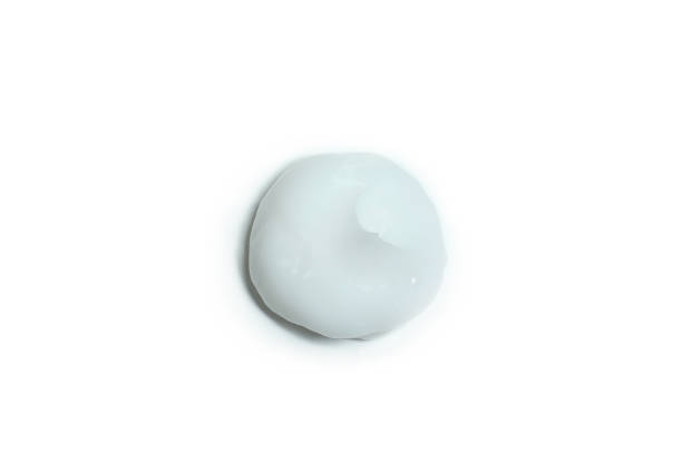 istock Sunscreen cream isolated on white background, close up 1312330676