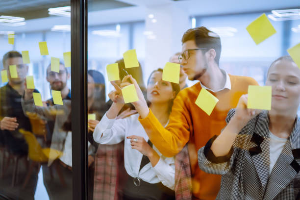 istock Group of young modern people working on project together. 1312332680