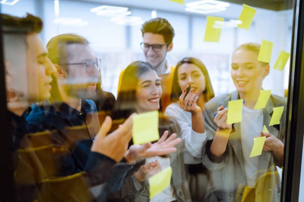 istock Group of young modern people working on project together. 1312332720