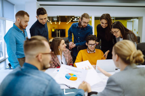 istock Group of young modern people working on project together. Planning, analysis. 1312333090