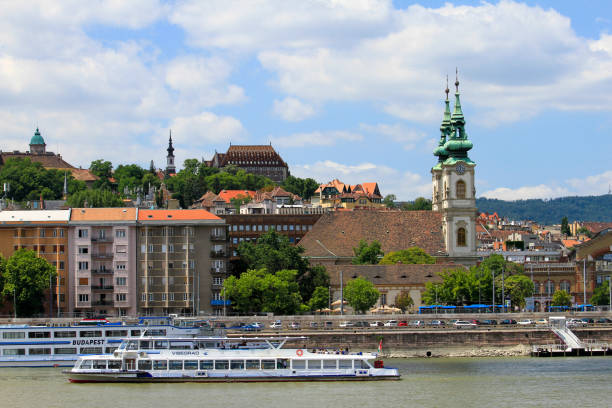 istock Steeples and buildings along river 1312333271