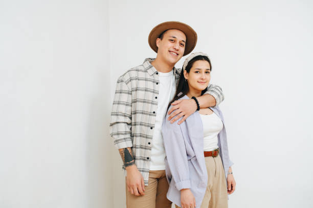 istock Loving young couple. Man is hugging woman from behind. 1312335103