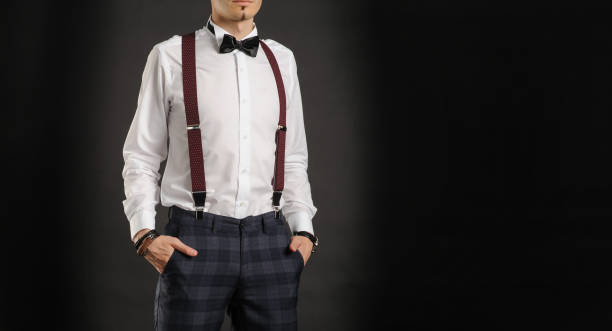 istock Young handsome boy in white shirt with tie, couse view, clock on hand, 1312335722