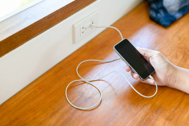 istock Charging Phone in Coffee Shop 1312337013