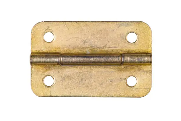 Brass hinge with screw holes in old condition, isolated on white background