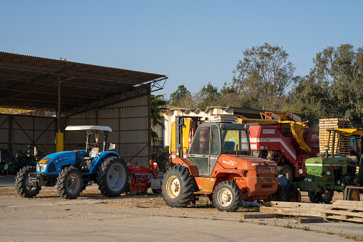 Tze'elim, Israel - March 13th, 2021: A tractors garage in an israeli kibbutz in southern Israel.