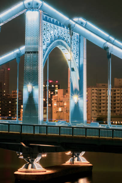 istock Lights on Self-Anchored Suspension Bridge over River 1312340785