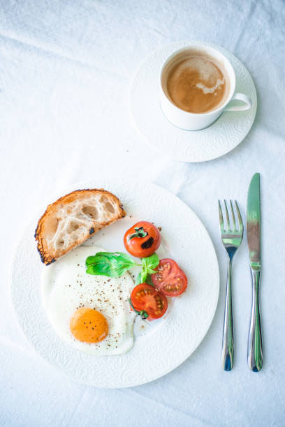 istock Fried eggs with grilled cherry tomatoes and toast. 1312343138